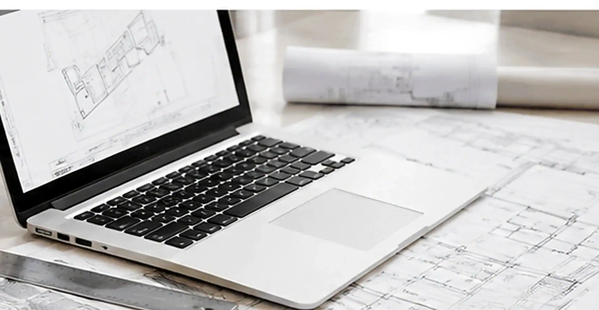 Laptop and architectural plans used for Division 10 signage estimating